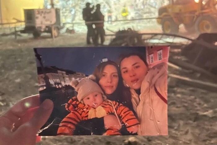 Photo of mother and son under rubble
